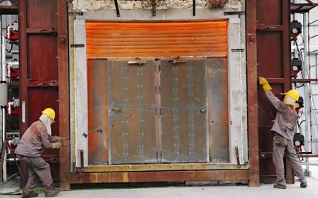 A Vertically Sliding Shutter combined with Steel Doorsets