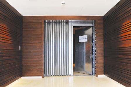 A Horizontally Sliding Shutter combined with Steel Doorsets